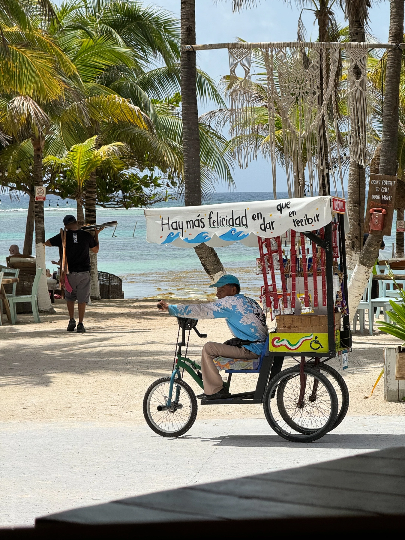 A vendor on a bicycle in Mahahual, Mexico.