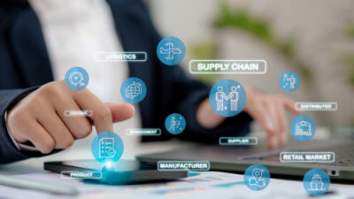A business person managing a logistic supply chain in an online dashboard..png