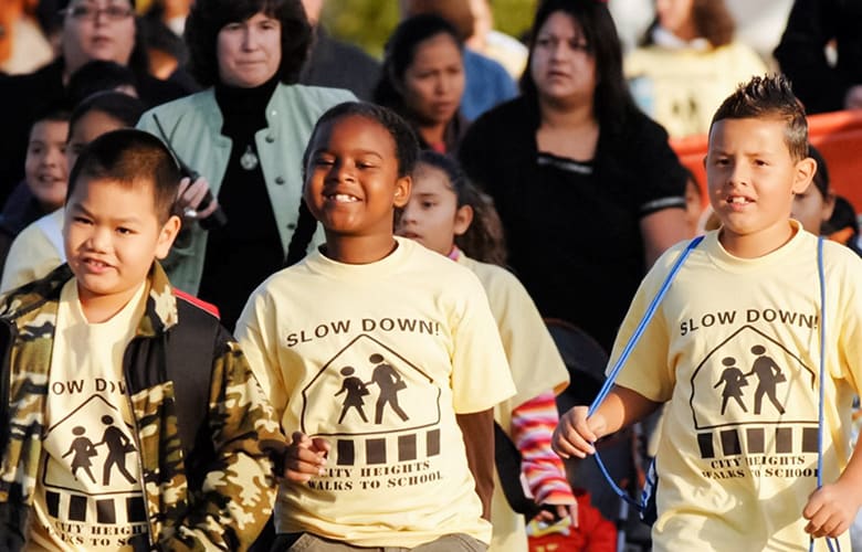 People walking to support City Heights Walk to School program People walking to support City Heights Walk to School program