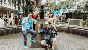 People gathered around the Hachiko statue at Shibuya Station, Tokyo.