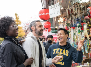 Local host exploring Tokyo with visitors during a cherr