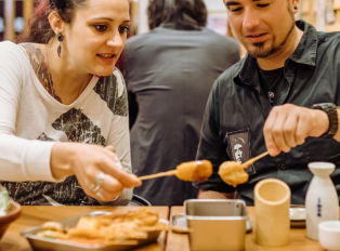 Couple enjoying some traditional Japanese food