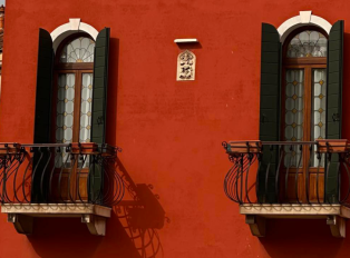 See wooden shutters line buildings