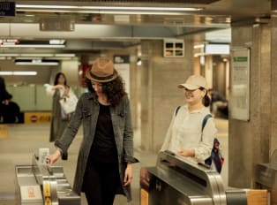 Traveler learning to navigate Kyoto, Japan with a local