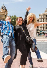 Local guide and tourists having fun while exploring the top sights in Barcelona