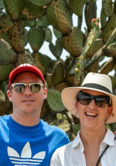 Tourists posing in front of huge cactuses in Mexico City