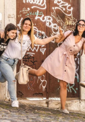 Tourists having fun with their local guide while on a private tour of Lisbon