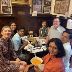 Family Gathering Around Traditional Flavors