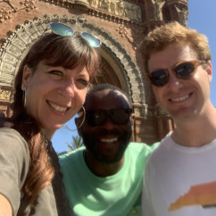 Smiles Beneath Iconic Arches