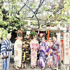 Cultural Harmony: Kimono-Clad Friends Amidst Ancient Toriis Cultural Harmony: Kimono-Clad Friends Amidst Ancient Toriis