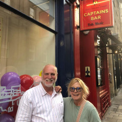 Charming Smiles at Captain's Bar: A Night of Folk and Fun