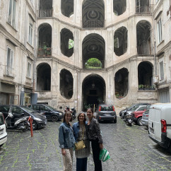Welcomed by History: Smiles in a Vintage Courtyard