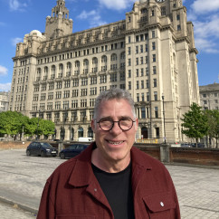 Smiles Beneath the Iconic Clock Tower