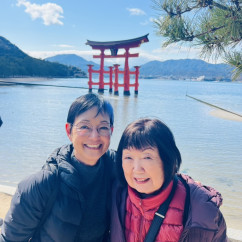 Smiles by the Historic Torii Gate