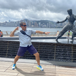 Showdown by the Harbor: A Playful Dance with a Legend