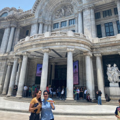 Visitors in front of Palacio de Bellas Artes, a cultural landmark in Mexico City.