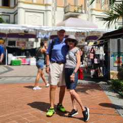 Sultan Mosque's golden dome with people passing by in Singapore.
