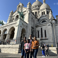 Group of people in front of Sacré-Cœur Basilica, Paris.
