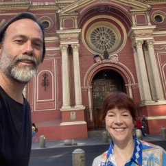 Two people in front of Basilica de la Merced in Santiago.