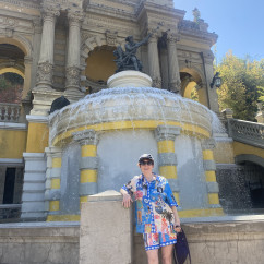 Person standing in front of the Fountain of Neptune, Santiago, Chile.