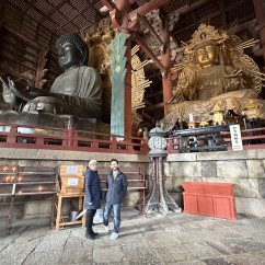 Taking in the grandeur of ancient statues in Nara's temple.