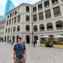 Person standing in front of Tai Kwun, Hong Kong.