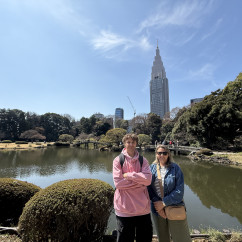 The NTT Docomo Yoyogi Building visible behind a pond.