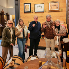 A cozy tasting moment unfolds in a charming Bologna shop.