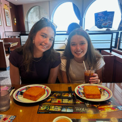 Sipping drinks and sharing smiles in a cozy Hong Kong café.