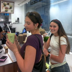 Tourists sipping matcha delights in Hong Kong.