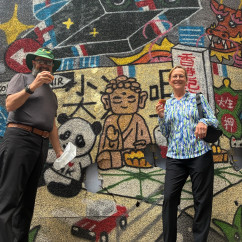 Colorful street art meets culinary delight on a lively day.