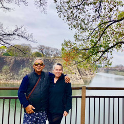 Enjoying a peaceful moment by the castle moat in Osaka.