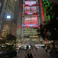 Night lights of Hong Kong create a striking urban backdrop.