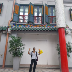 A curious glance up at Singapore’s colorful shophouse façade.
