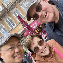 Sharing smiles in a bustling Munich square.