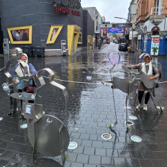 Amusing street sculptures brighten a rainy day in Hamburg.