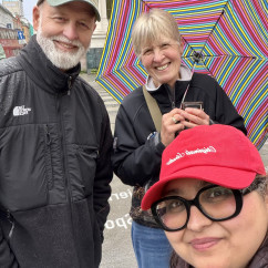 Enjoying a rainy Oslo day with smiles and stripes.