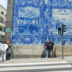A quiet pause by the stunning azulejos in Porto.