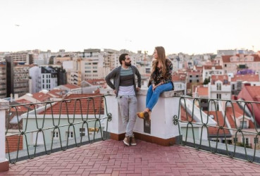 Couple of tourists enjoying an evening out in Lisbon