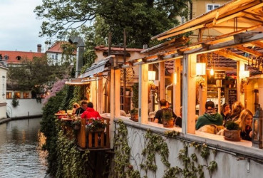 A typical riverside restaurant full of local diners in Prague