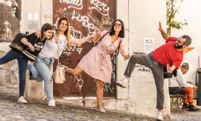 Tourists having fun with their local guide while on a private tour of Lisbon