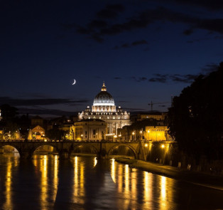 Walk along the Tiber River in the evening