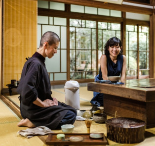 Enjoying a traditional tea ceremony while on a tour in 