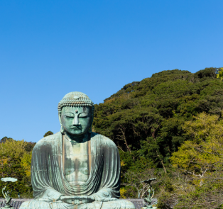 Great Buddha statue with trees in the background