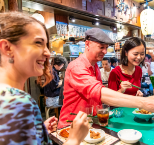 Travelers enjoying Japanese food