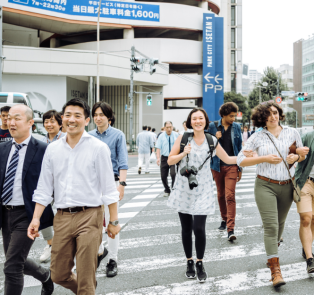 People walking across a pedestrian crossing