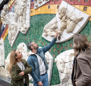 Couple admiring art with a local guide