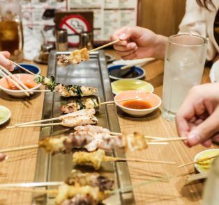 People enjoying traditional Japanese food in Kyoto