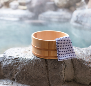 Hot spring bath with a bamboo cup
