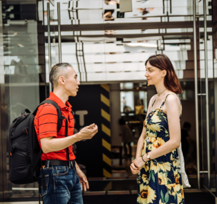 Tour guide and tourist having a conversation